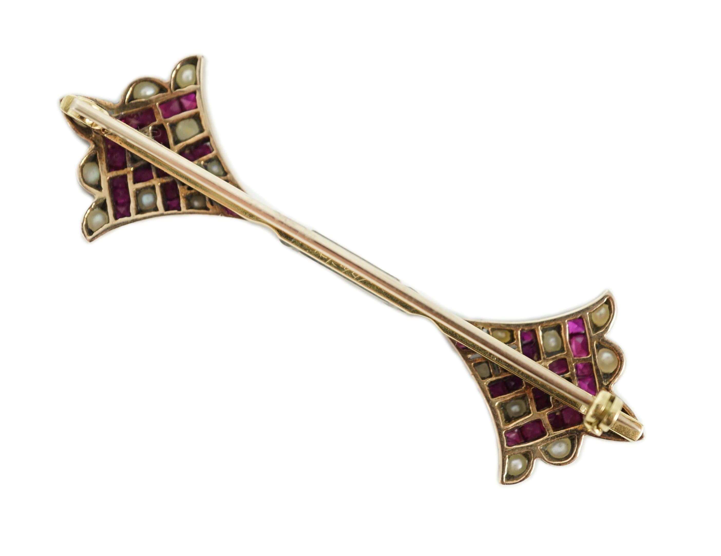 An early 20th century, gold, platinum, ruby and seed pearl set brooch